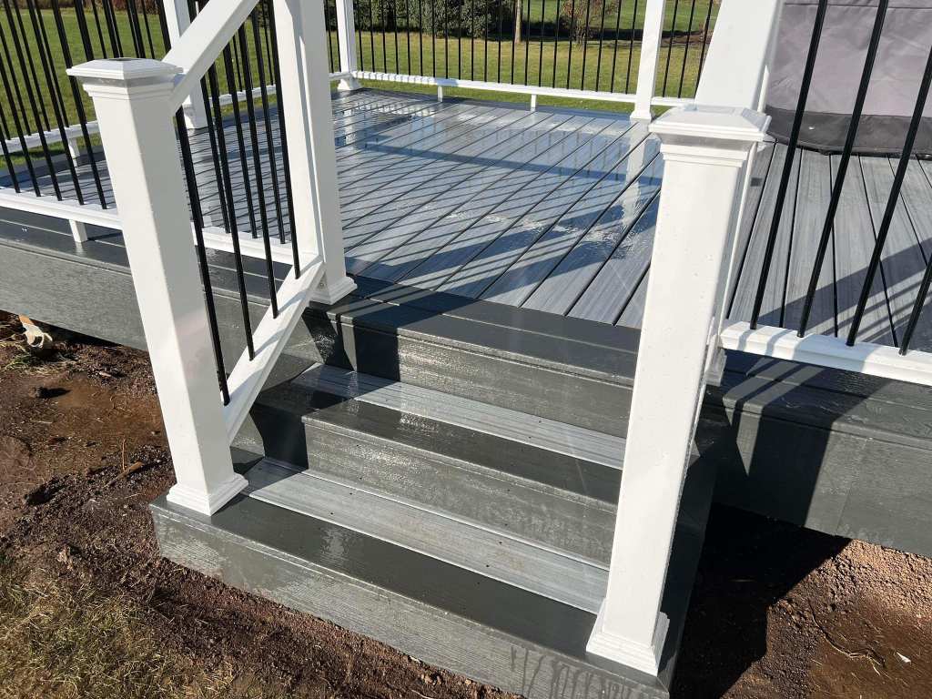 Custom-built wooden deck with stairs by IW Brothers LLC in Sheboygan
